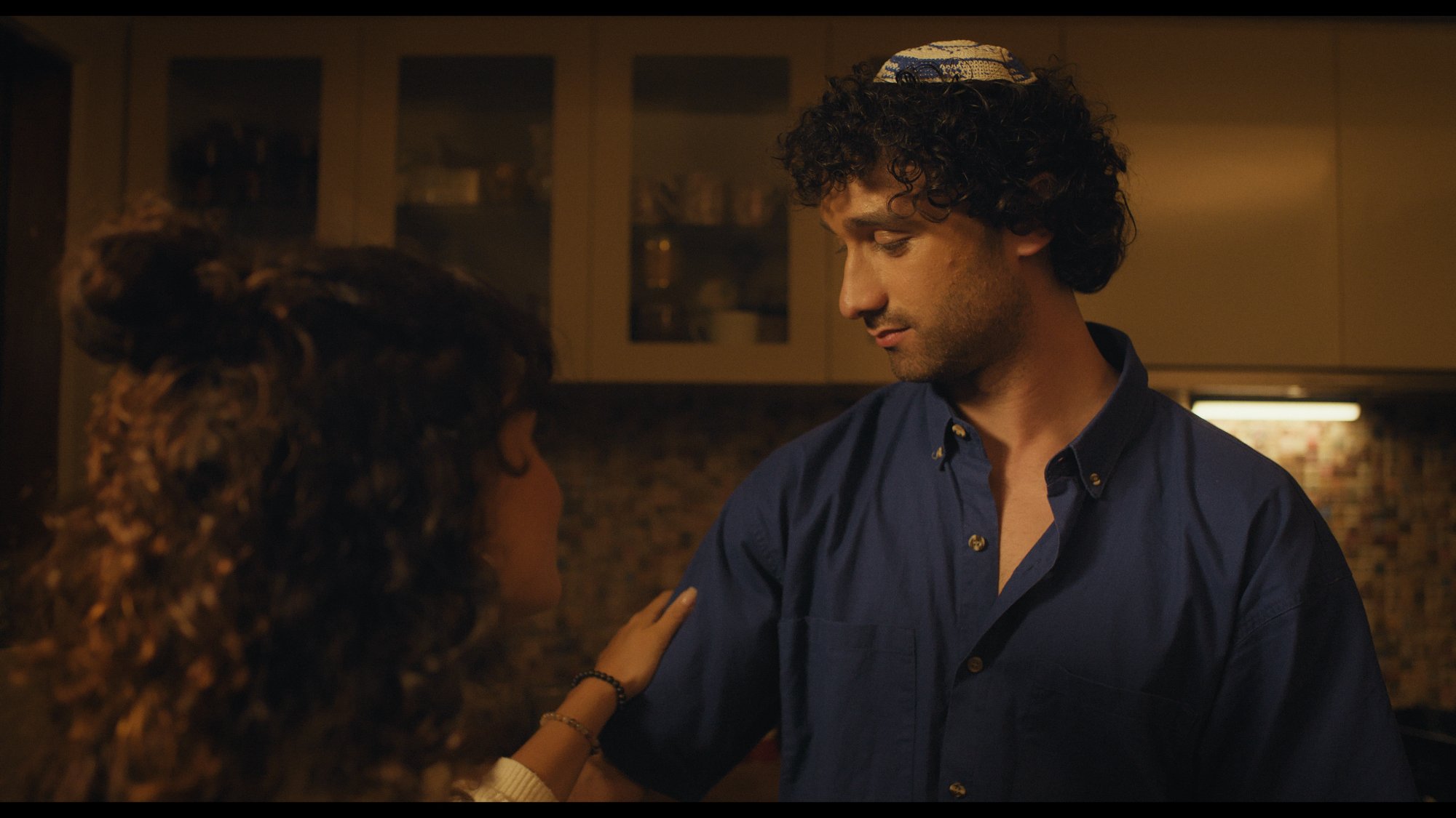 Film still — kitchen scene